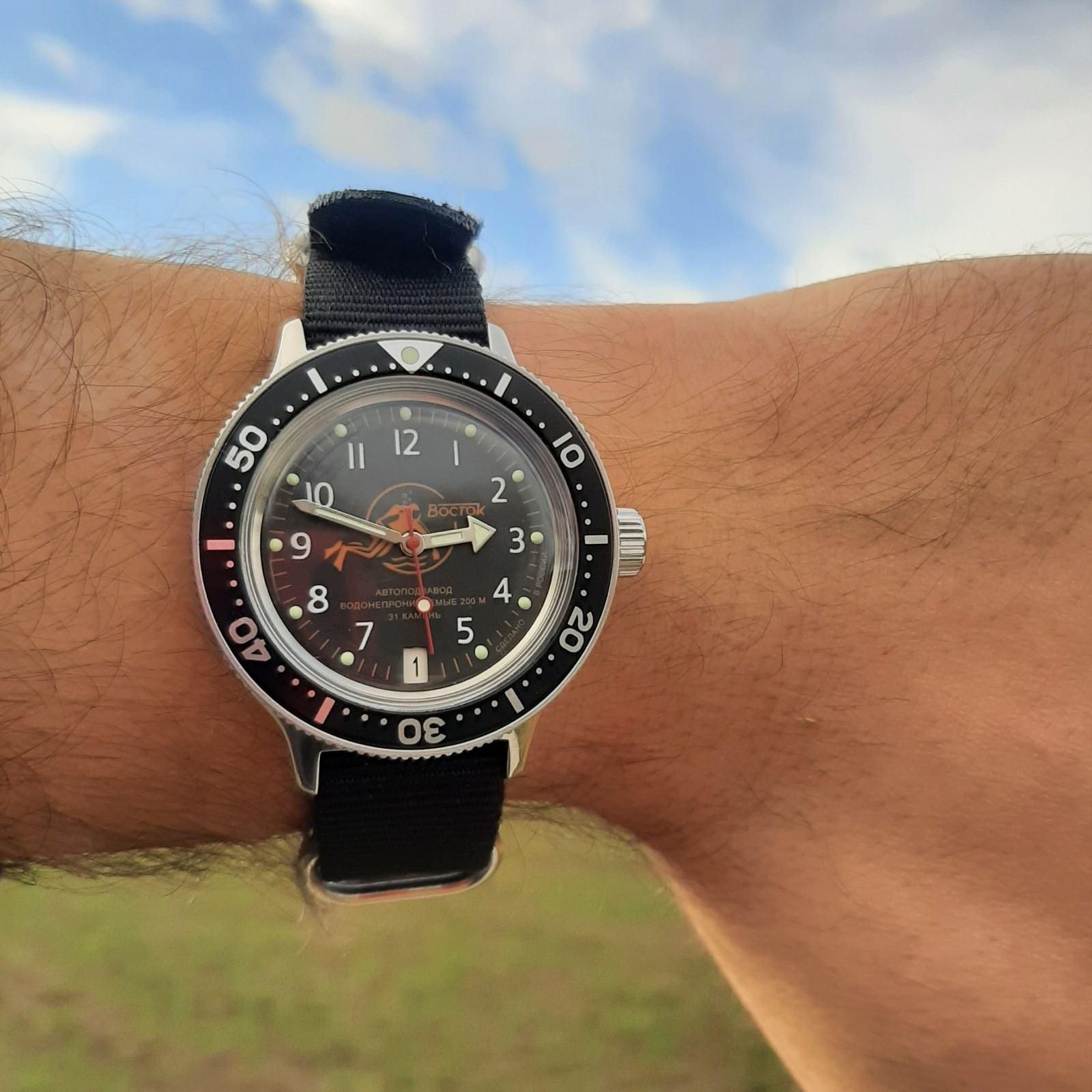 Vostok Amphibia - Black & Orange Scuba Dude | WatchCrunch